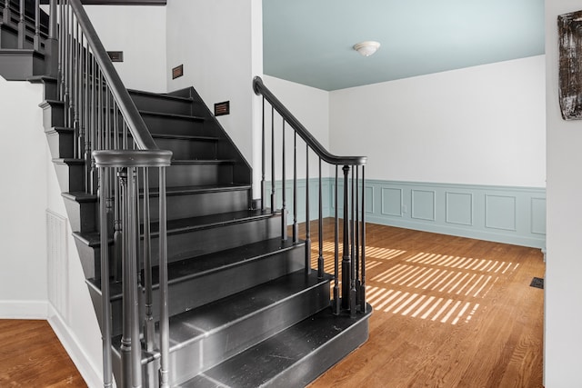 stairway featuring hardwood / wood-style floors