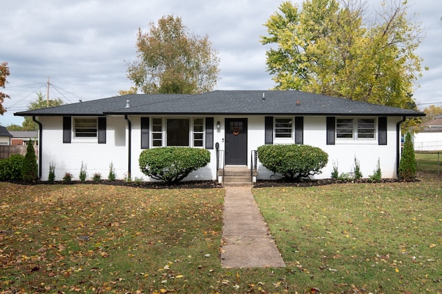 single story home with a front yard