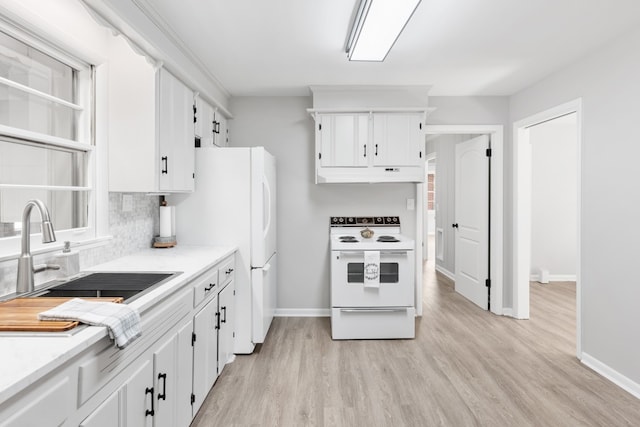 kitchen featuring sink, white cabinets, light wood-type flooring, and white appliances