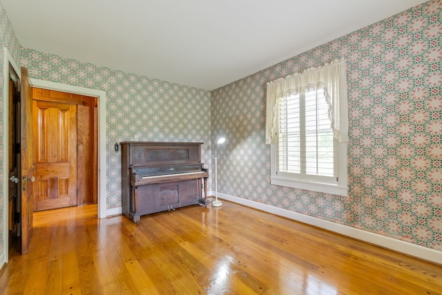 unfurnished bedroom with hardwood / wood-style floors