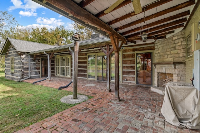 view of patio / terrace with an outdoor stone fireplace