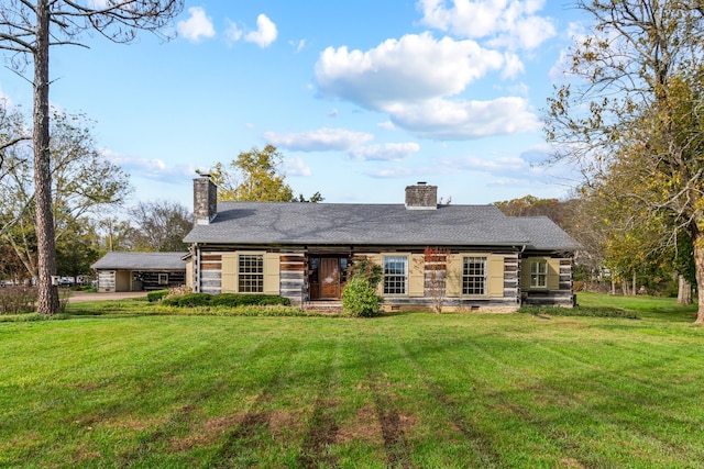 back of property featuring a lawn