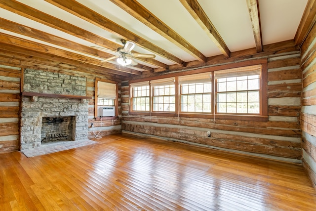 unfurnished living room with ceiling fan, plenty of natural light, and light hardwood / wood-style flooring