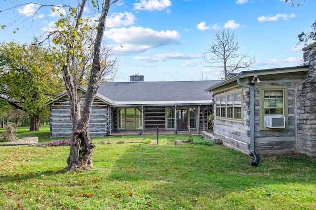 view of front of house featuring a front yard and cooling unit