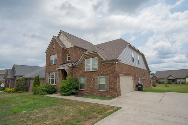 view of front of house with a front lawn and a garage