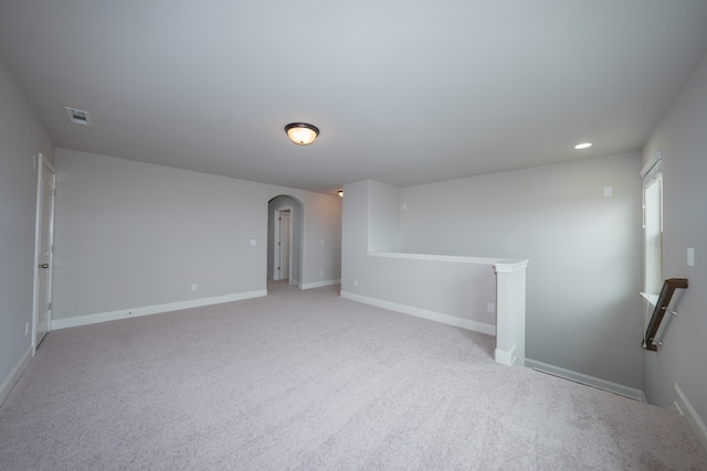 unfurnished room with light colored carpet