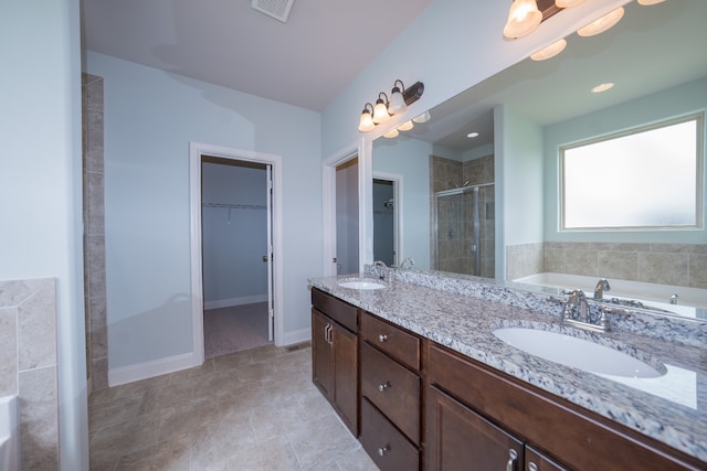 bathroom featuring vanity, separate shower and tub, and tile patterned flooring