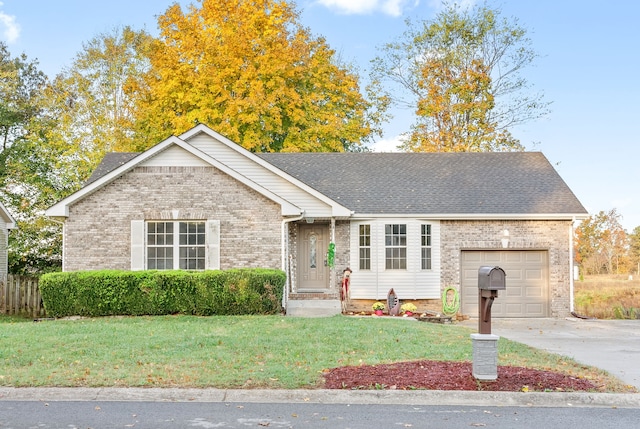 ranch-style home featuring a garage and a front yard