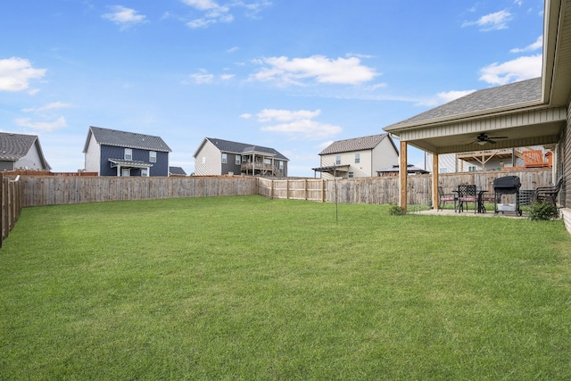 view of yard with ceiling fan