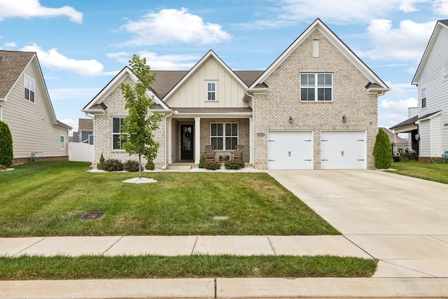 view of front of house with a front yard and a garage