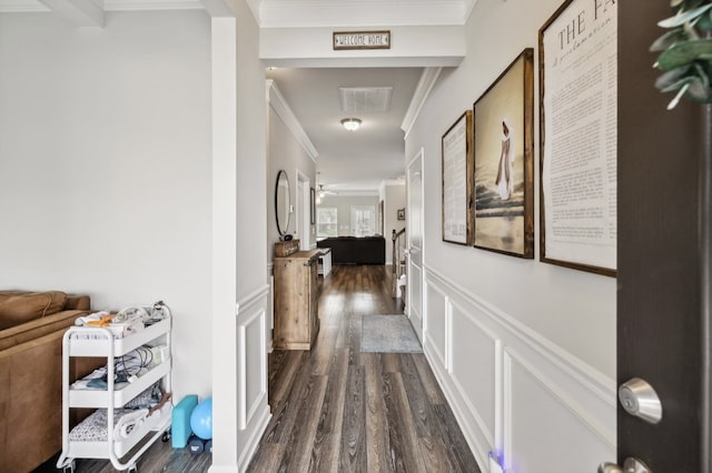 corridor featuring ornamental molding and dark hardwood / wood-style flooring