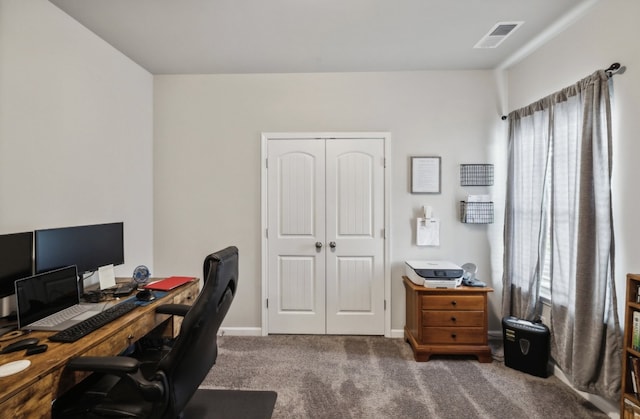 home office featuring a healthy amount of sunlight and carpet floors