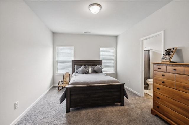 carpeted bedroom with ensuite bathroom