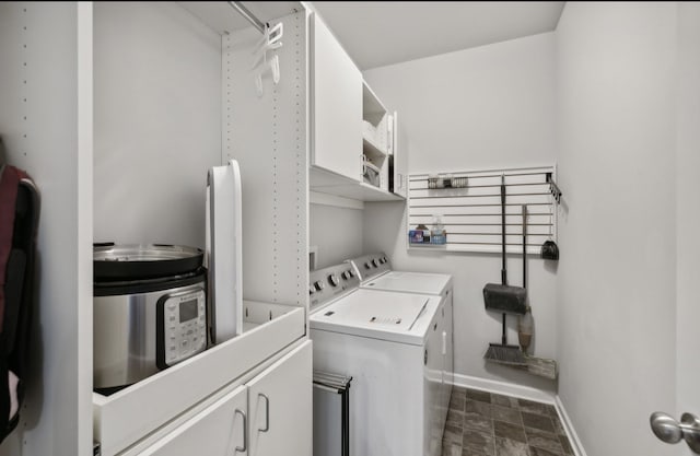 washroom with cabinets and independent washer and dryer