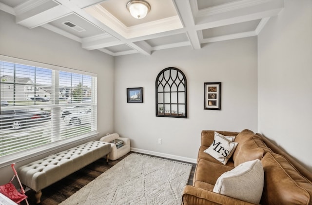 sitting room with beamed ceiling, crown molding, and coffered ceiling