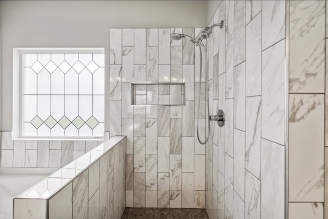 bathroom with tiled shower