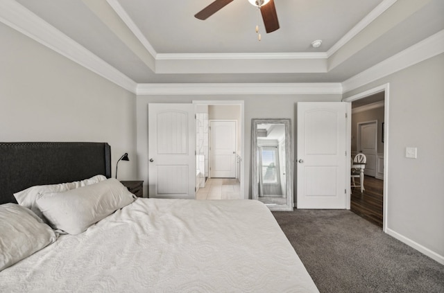 carpeted bedroom featuring ornamental molding and ceiling fan