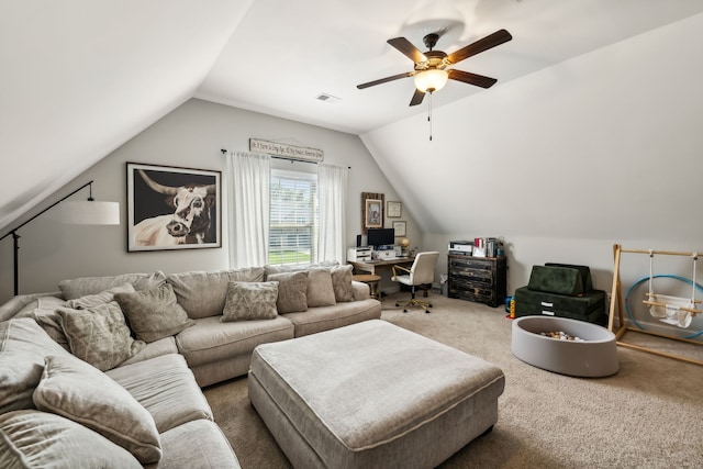 living room featuring ceiling fan, carpet floors, and vaulted ceiling