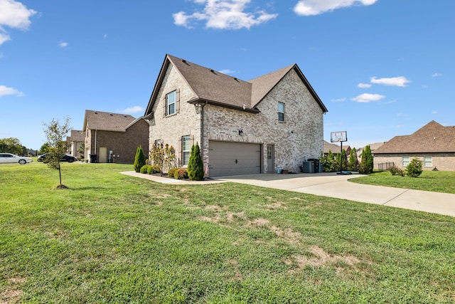 view of side of home with a garage and a yard