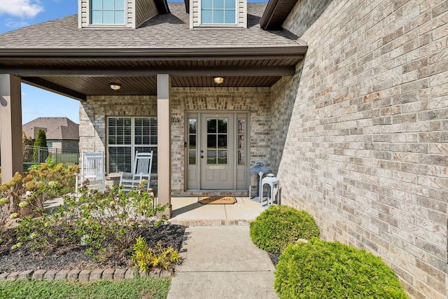 entrance to property featuring a porch