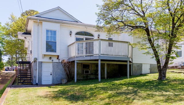 rear view of property featuring a yard and a deck