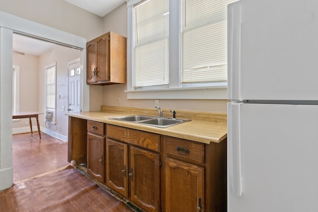 kitchen featuring sink and white refrigerator