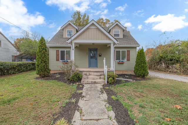 bungalow-style home featuring a front yard and a porch