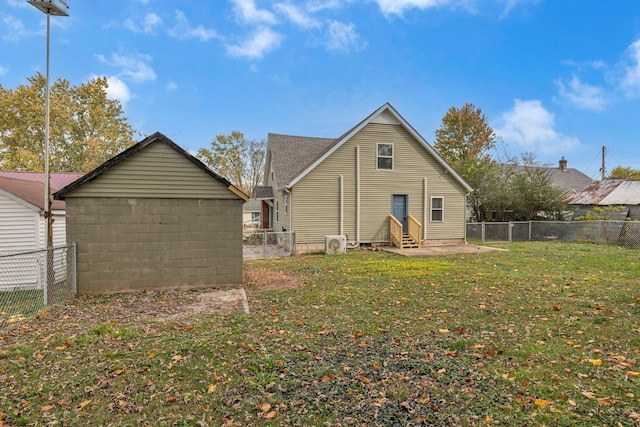 back of house with a yard