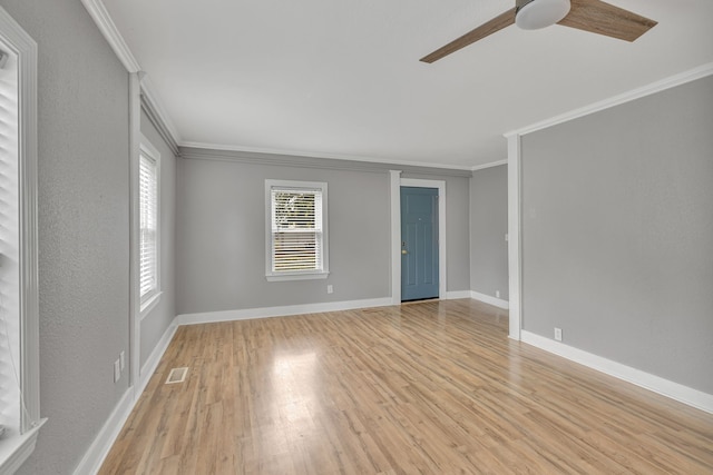 unfurnished room with light hardwood / wood-style floors, crown molding, and ceiling fan