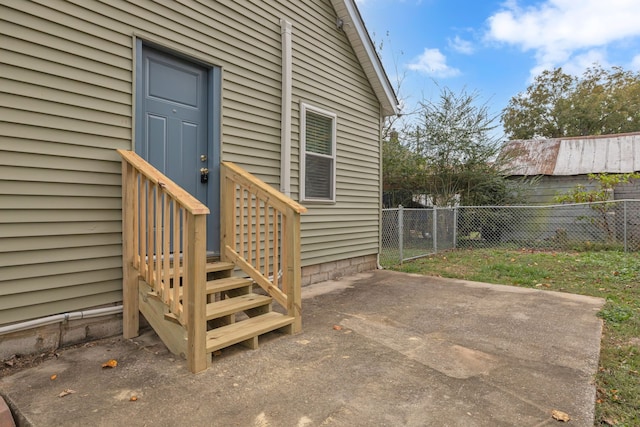 doorway to property with a patio area