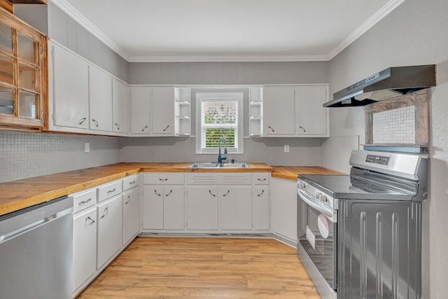 kitchen with range hood, sink, light wood-type flooring, white cabinetry, and appliances with stainless steel finishes