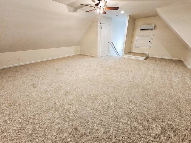 additional living space featuring light carpet, lofted ceiling, a wall unit AC, and ceiling fan