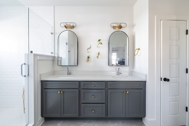 bathroom featuring vanity and an enclosed shower