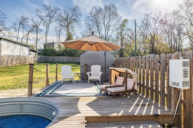 wooden terrace featuring a lawn and a storage unit