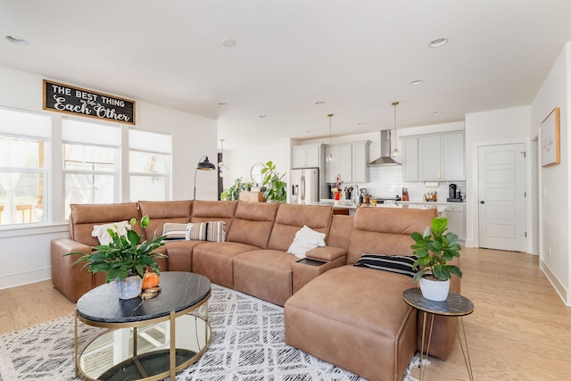 living room with light hardwood / wood-style flooring