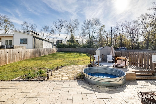 view of patio / terrace featuring a deck and a storage shed