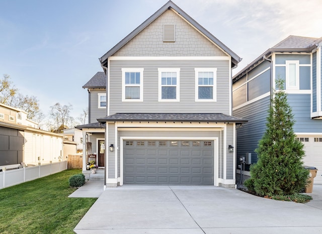 view of front facade with a garage and a front yard