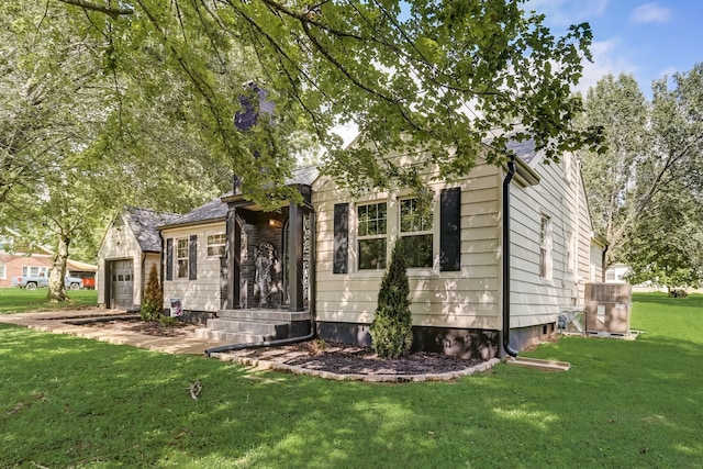 view of front of property featuring a front lawn and central AC unit