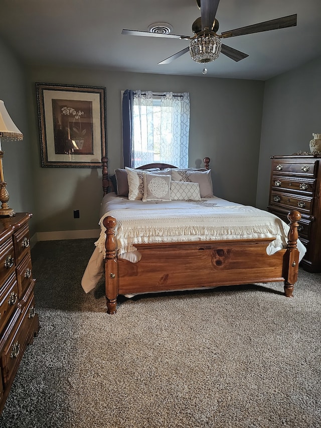 bedroom with dark colored carpet and ceiling fan