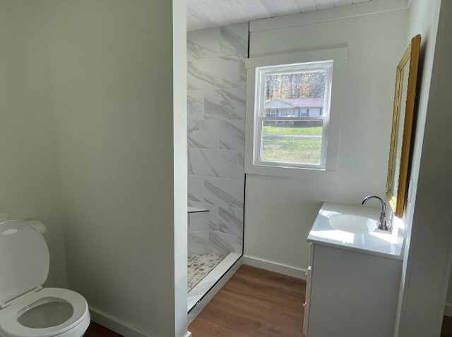 bathroom featuring wood-type flooring, vanity, toilet, a shower, and wooden ceiling