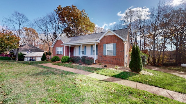 view of front of house featuring covered porch and a front lawn