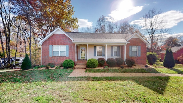 single story home featuring a front yard and a porch