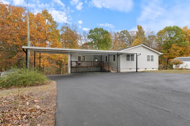 view of front of property featuring a carport