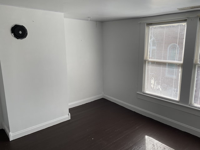 empty room featuring dark hardwood / wood-style floors