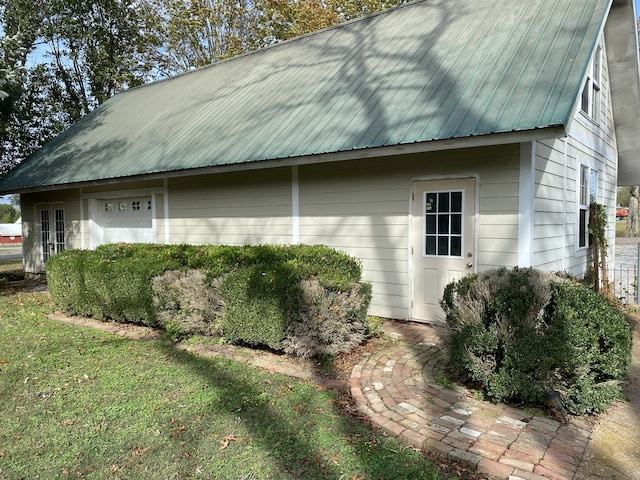 view of side of home featuring a yard