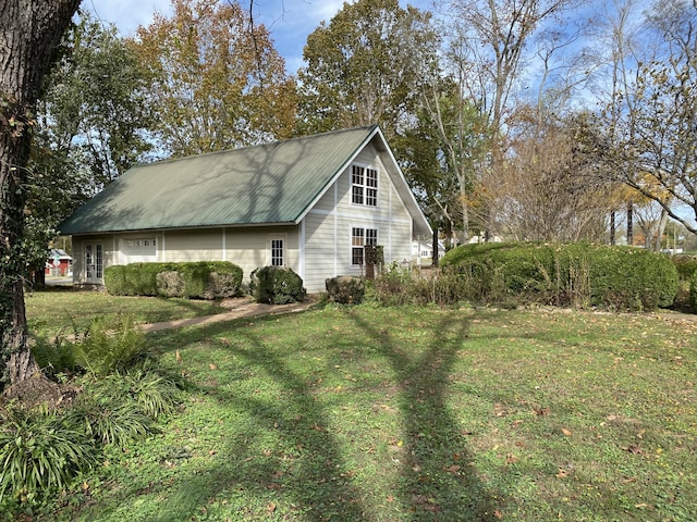 view of home's exterior featuring a lawn