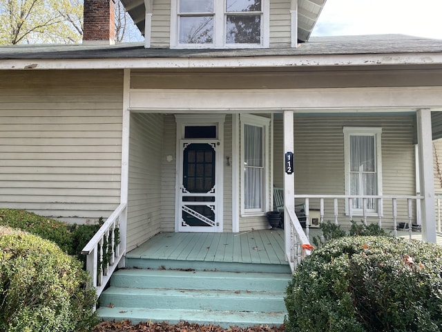 doorway to property featuring a porch