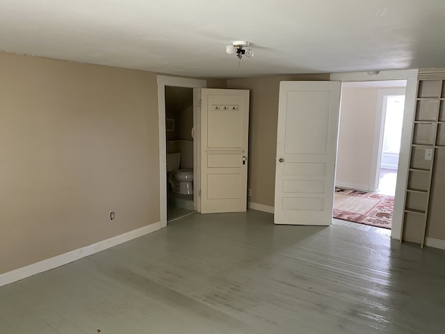 unfurnished room featuring wood-type flooring