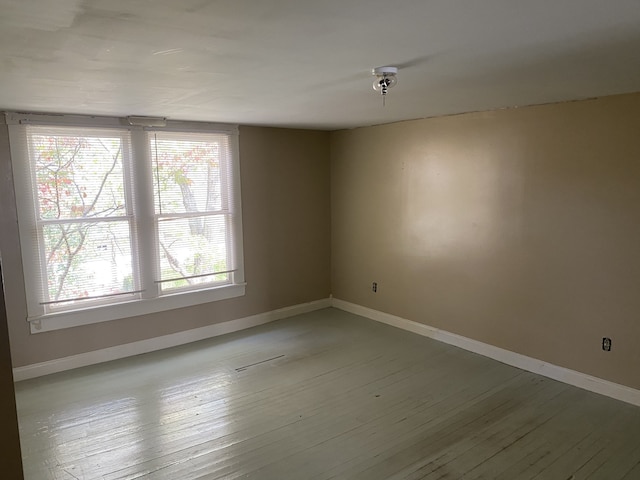 spare room featuring hardwood / wood-style flooring