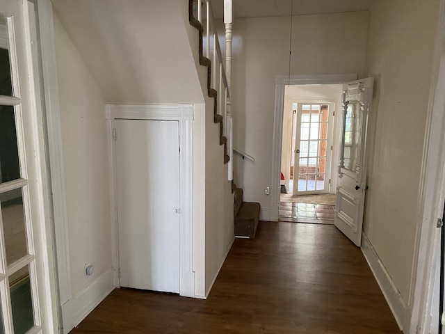 hallway with dark hardwood / wood-style floors